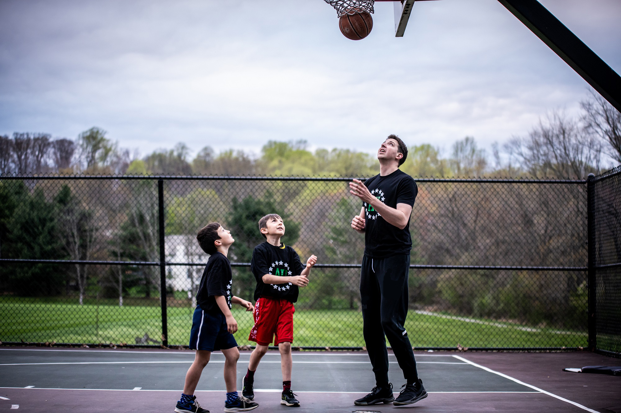 Private Basketball Coach training two young athletes