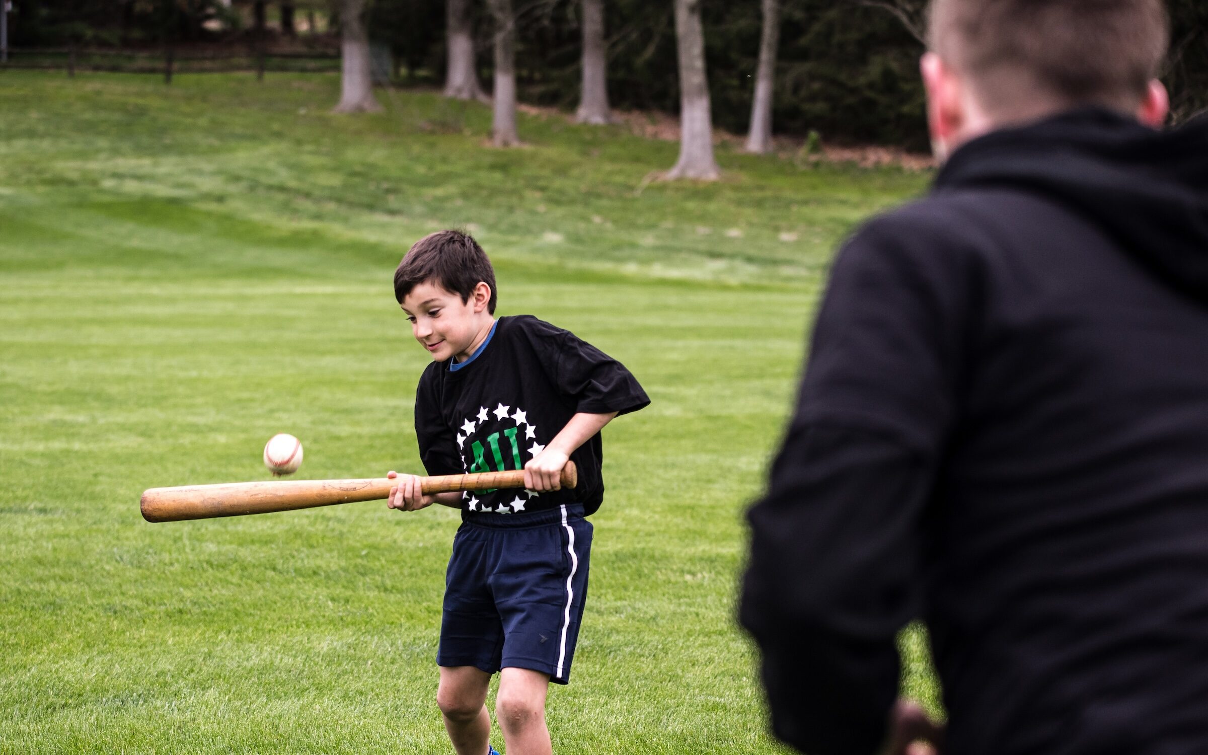 Young athlete taking lessons with a private baseball coach