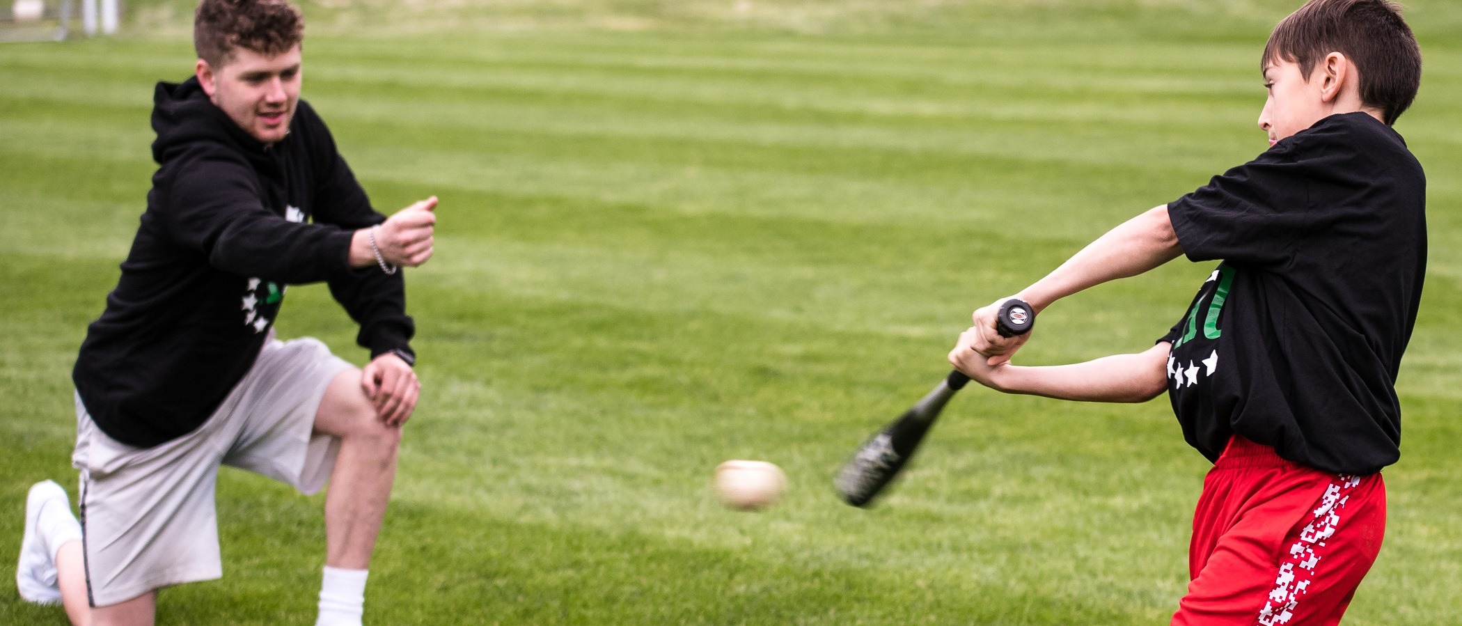 Baseball player practicing during a private lesson