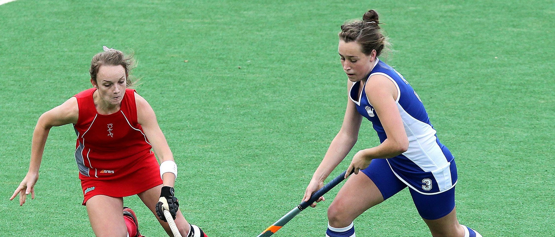 Field hockey players competing during a private lesson