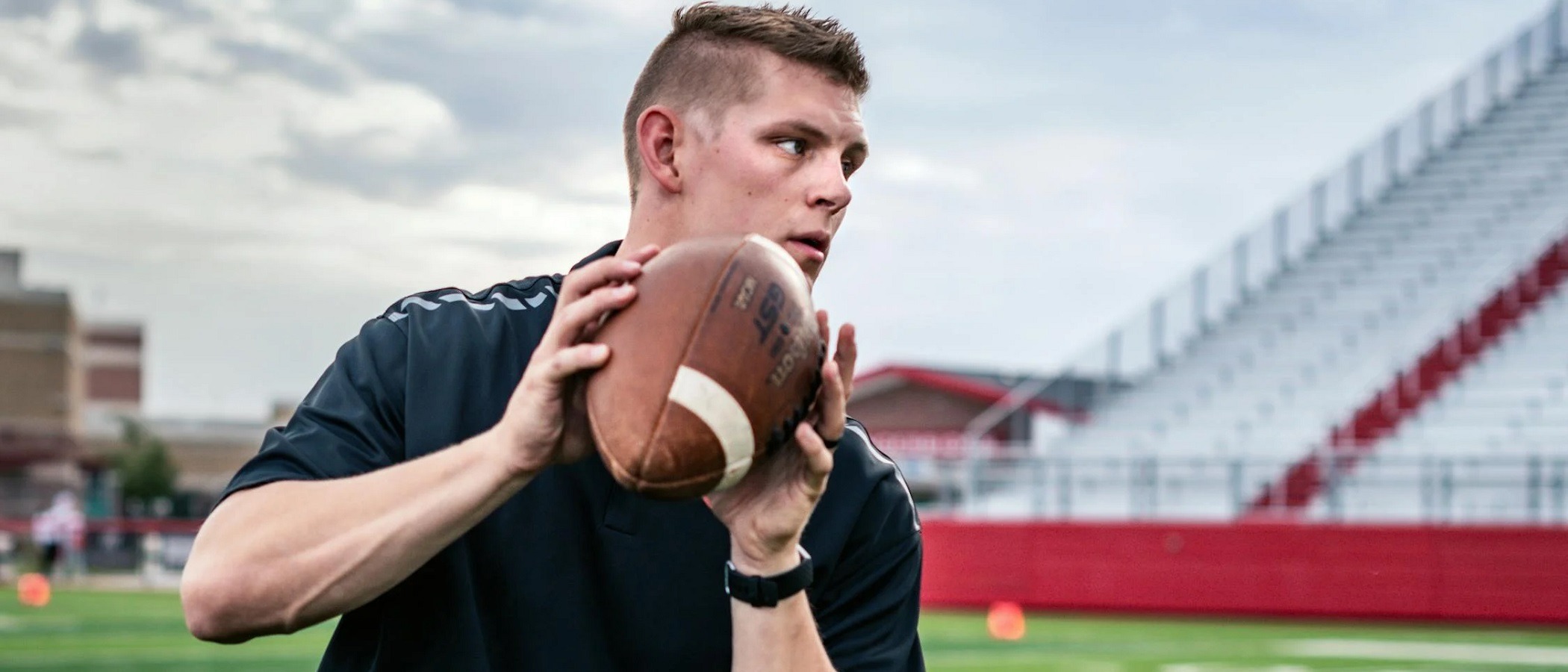 Private football coach preparing for a lesson