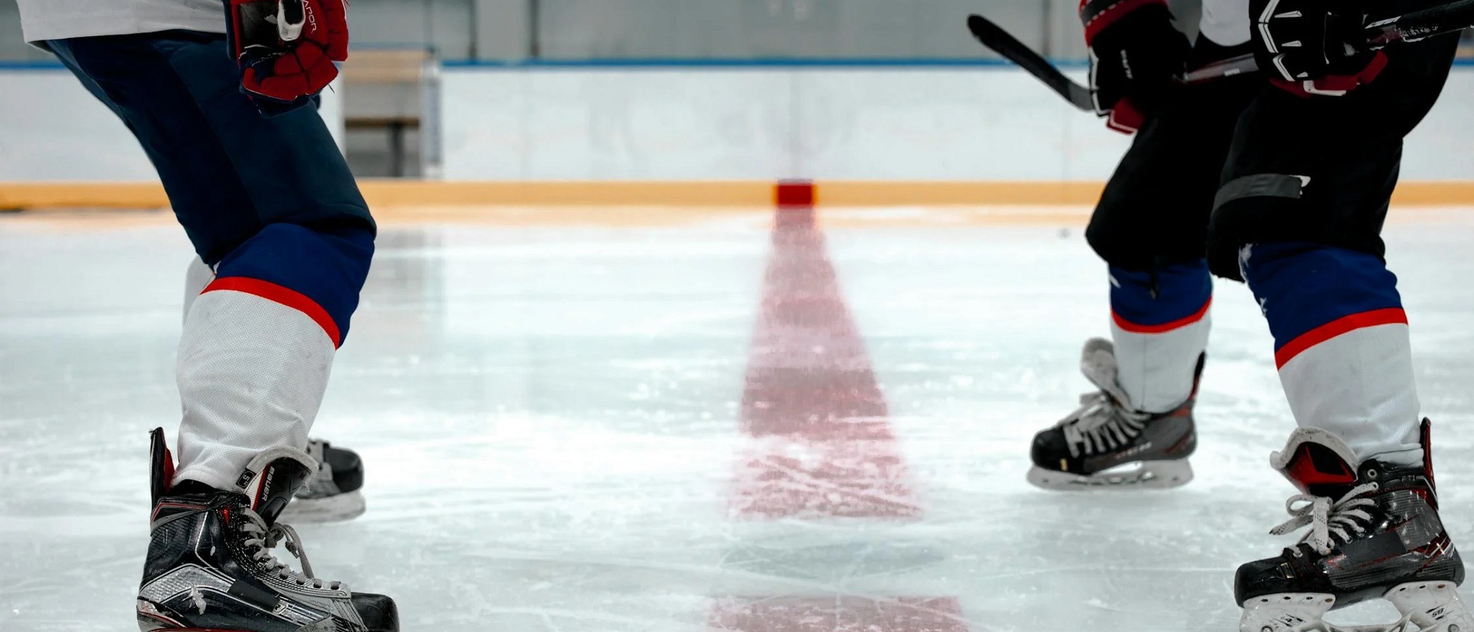 Athletes training together during a private ice hockey lesson