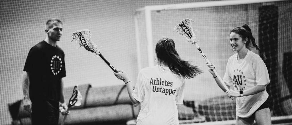 Lacrosse players practicing during a private lesson