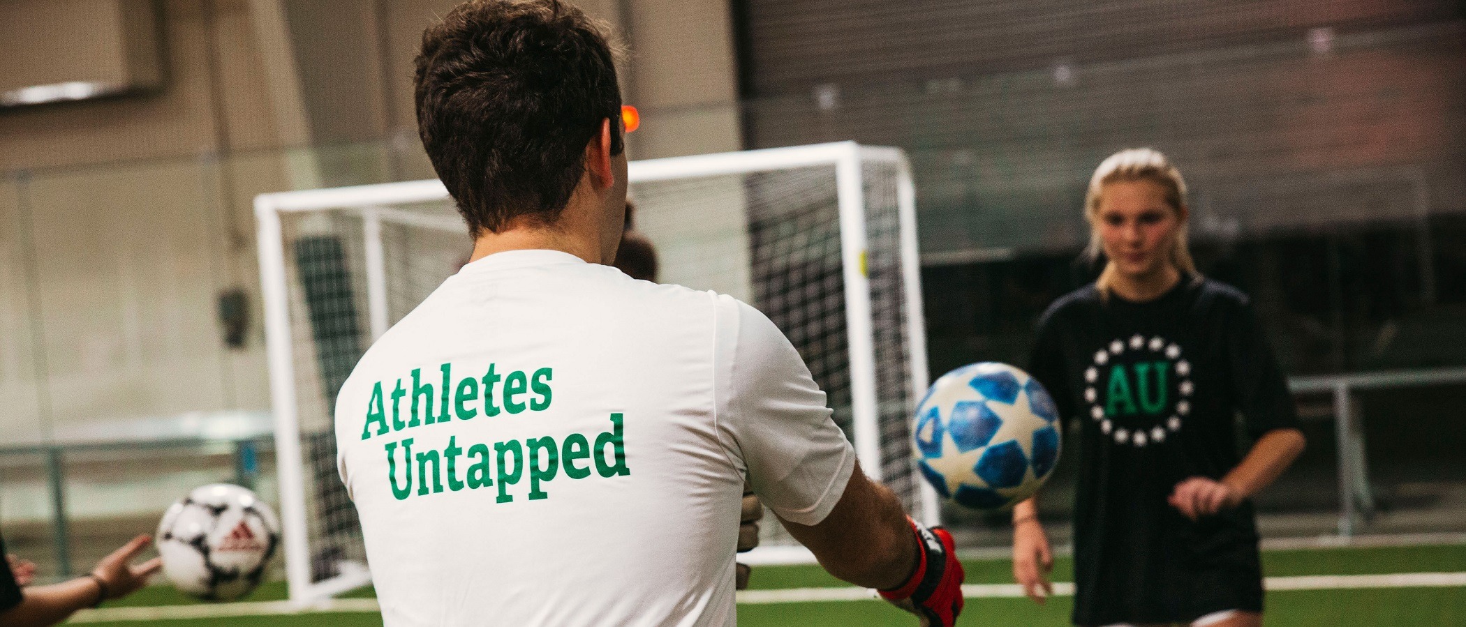 Soccer player practicing with coach during a private lesson