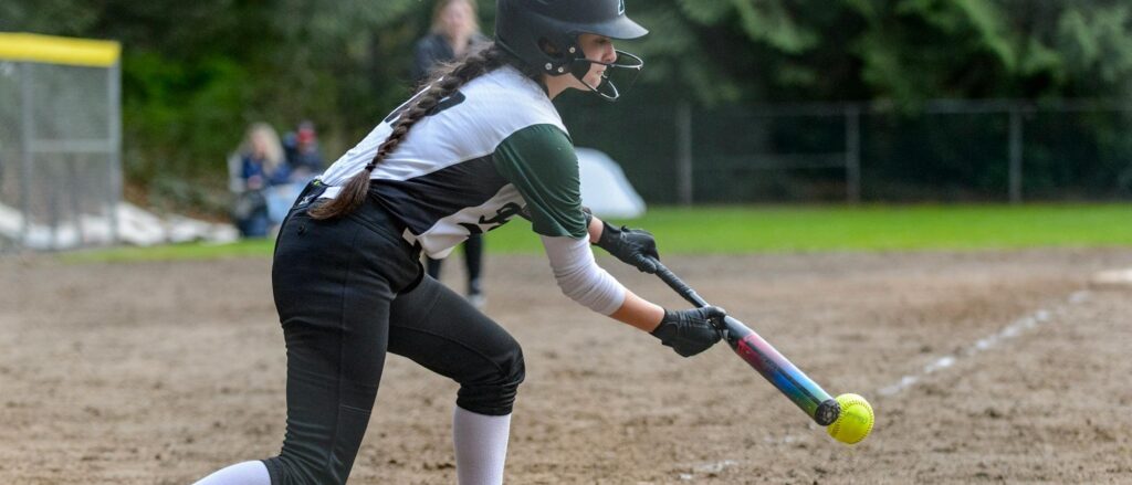 Softball player practicing during a private lesson