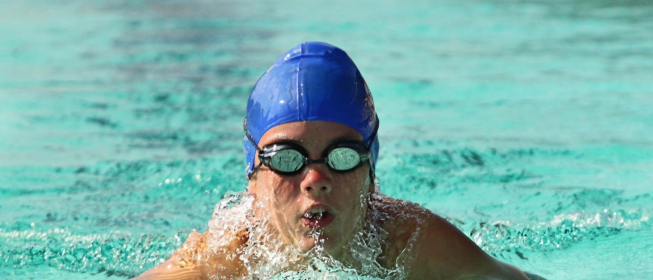 Swimmer training during a private swimming lesson