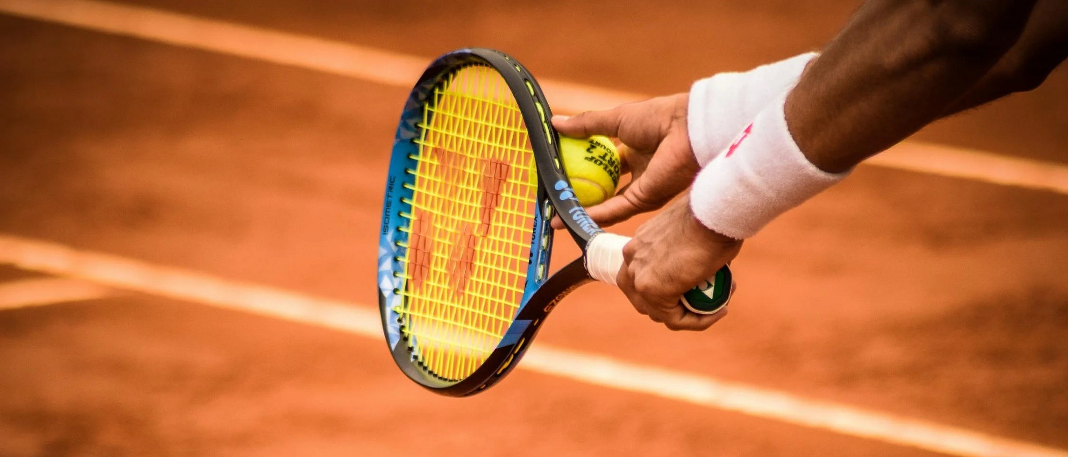 Preparing drills for a private tennis lesson